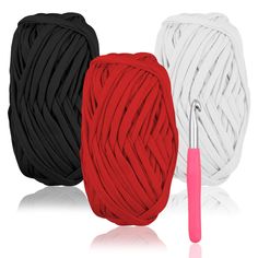 three different colors of yarn and a crochet hook