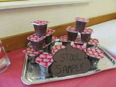 a tray that has some cups on it with the words stool sample written on it