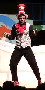 a man dressed as the cat in the hat on stage