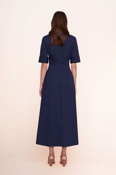 A maxi shirt dress made out of stretchy cotton poplin, the Joan Dress is a modern yet polished take on a classic. Chic Cotton Maxi Shirt Dress, Navy Cotton Midi Dress, Elegant Navy Cotton Dress, Fitted Maxi Length Cotton Shirt Dress, Fitted Cotton Maxi Shirt Dress, Cotton Fitted Maxi Dress For Work, Fitted Cotton Maxi Dress For Work, Navy Cotton Dress For Work, Maxi Shirts