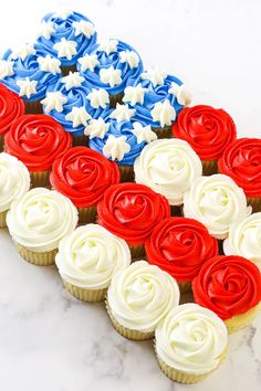 cupcakes with red, white and blue frosting in the shape of an american flag