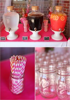 there are many different shots and candy in glass jars on the table with pink cloth