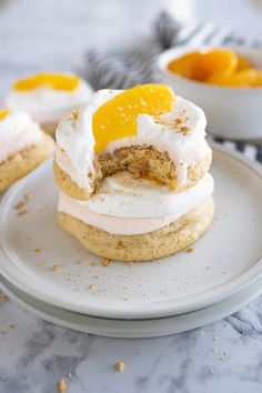 Peaches and cream is a classic flavor combination that is perfect for summer, and these Peaches and Cream Cookies are no exception. With a graham cracker cookie base, peach buttercream, whipped topping, and a fresh peach slice on top, these cookies are a delightful treat that are pretty much a fresh peach cobbler, in cookie form. | peaches & cream cookies | peach cookie recipes | peach cobbler cookie recipes | summer peach dessert recipes | summer peach desserts easy | peach recipes Cookie Recipes Summer, Peach Frosting, Peach Cookies Recipe, Peach Buttercream, Peach Desserts Easy, Graham Cookies, Peach Cookies, Graham Cracker Cookies