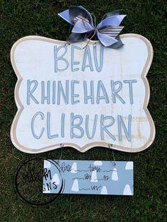 a sign on the grass that says beau rhine hart cliburn next to it