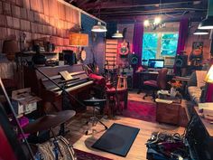 a room filled with lots of musical equipment