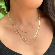 A basic chain necklace that is anything but plain, Alexandra’s Herringbone Necklace gives you the oh so chic layered chain look without having to layer multiple gold necklaces. Details:• 18kt Gold Plated Stainless Steel • Chain Length: Adjustable from 14.5" to 17" Delicate Chain Herringbone Necklace For Layering, Elegant Double Chain Snake Necklace For Layering, Minimalist Double Chain Yellow Gold Necklace, Minimalist 14k Gold Double Chain Necklace, Gold Snake Chain Layered Necklace, Minimalist Multi-strand Yellow Gold Necklace, Minimalist Multi-strand Clavicle Chain Necklace, Gold Layered Snake Chain Necklace, Minimalist Multi-strand Gold Chain Necklace