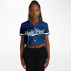 Chicago Vocational School Cropped Baseball Jersey | CVS Cavaliers Show up in style with this cropped baseball jersey. This top is a must-have for any modern fashionista. The chic design is casual yet trendy, making it a perfect addition to your wardrobe essentials. Designed with versatility in mind, the jersey’s lightweight moisture-wicking fabric will keep you cool during game days and hot summer nights out with friends. Plus, it has a button front closure that makes it very easy to wear. • 100% polyester • Sweat-wicking fabric • Lightweight, breathable feel • Neck ribbing in solid black, solid white, half black / half white color • High definition printing Collegiate Summer Streetwear Tops, Sporty Crop Top For College In Spring, Blue Varsity Top With Baseball Collar, Trendy Navy Tops For Streetwear, Varsity Jersey Top With Baseball Collar, Navy Collegiate Top For Streetwear, Collegiate Tops With Letter Print And Baseball Collar, Casual Blue Baseball Jersey, Sporty Jersey Tops With Baseball Collar