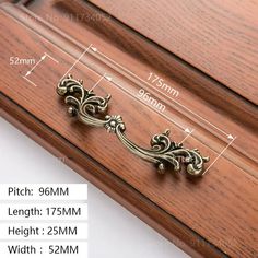 an image of wooden furniture with measurements for the handles and drawer knobs on it