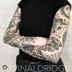 a woman with many tattoos on her arms