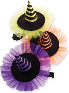 three hats with different colors and designs on top of each other, one has a black hat