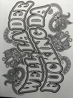 an image of some type of lettering that is black and white with paisley designs on it