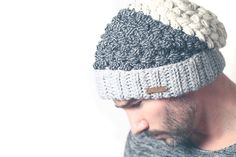 a bearded man wearing a knitted hat