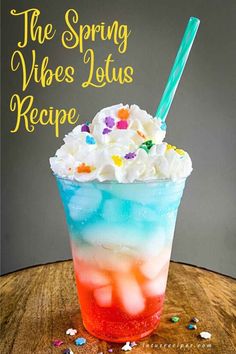 the spring vibes lotus recipe in a tall glass with whipped cream and sprinkles