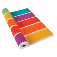 a roll of colored paper sitting on top of a white surface