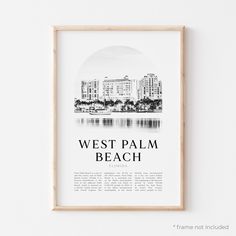 the west palm beach poster is hanging in front of a white wall with a wooden frame