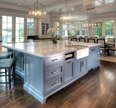 a large kitchen with an island in the middle