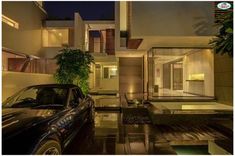 a car parked in front of a house at night