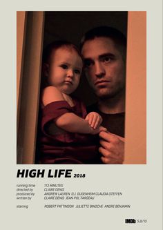 a man holding a baby in his arms while standing next to him on the cover of high life