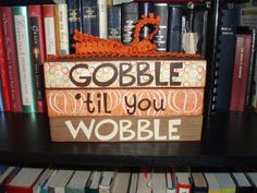 there is a sign that says gobble it'll you wobble on the shelf