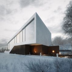 a white building sitting on top of a snow covered field