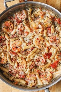 creamy mozzarella shrimp pasta in a skillet on a wooden table with text overlay