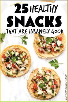 the cover of 25 healthy snacks that are insanely good by an image of three pita breads with vegetables on top