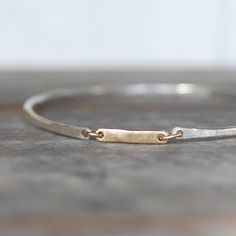 "Sterling silver and 14k gold \"Gold Bar Bangle\". Elegant yet casual, a little bit of luxury for every day wear. Details: Gold bar - 3/4\" L x 3mm W x 1.25mm thick Gold - 14k yellow - Eco-friendly, recycled Sterling Silver - Eco-friendly, recycled *Choose from small (2 1/4\" Inner diameter), medium ( 2 1/2\" inner diameter) and large (2 3/4\" inner diameter) when you check out. Would you like to add some sparkle? Check out the \"Diamond Bar Bangle\" here: https://www.etsy.com/listing/220299692/ The Bangles, Lake Oswego, Sterling Bracelets, Gold Link, Diamond Bar, Silver Jewelry Handmade, Silver Bangle Bracelets, Diamond Bangle, Sterling Silver Bangles