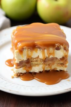 a piece of caramel apple cheesecake on a white plate with caramel sauce