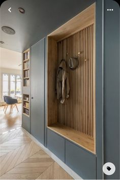 a wooden bench sitting in the middle of a room