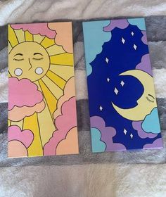 two colorful paintings on a bed next to each other with the sun and moon painted on them