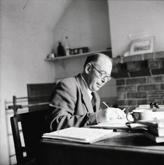 a man sitting at a desk with a book in front of him and the caption reads, failures are finger posts on the road to achievement