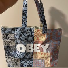 Large Obey Pvc Tote With Poplin Underlay Large Inside Pocket 100% Polyester Large Straps To Put Over The Shoulders Brand New Without Tags; Haven't Been Used Large Bandana, Large Tote Bag, Large Tote, Womens Tote Bags, Inside Pocket, Diaper Bag, Reusable Tote Bags, Tote Bag, Brand New