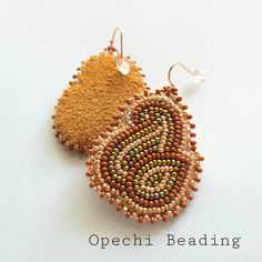 Native American beaded earrings ~ Beaded Earrings ~ Beaded floral ~ beadwork ~ earrings  -handmade -size 11 Czech beads, Czech cut beads, and Japanese beads -colors : rose gold, dark brown, light brown,  and bronze  -Porcupine Quillwork   -smoked leather backing  -rose gold plate hooks -Ojibwe made Traditional Brown Beaded Earrings With Tiny Beads, Handmade Brown Teardrop Beaded Earrings, Unique Beaded Earrings With Bead Caps, Brown Teardrop Beaded Earrings With Colorful Beads, Brown Teardrop Beaded Earrings, Floral Beadwork, Native Earrings, Beads Colors, Beadwork Earrings