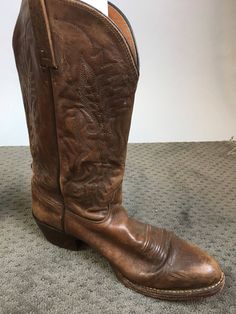 Vintage brown leather western cowboy boots size 9.5 well worn but still in great shape Toe to wall insole 11.5 Inches Ball of foot 4 Inches Height 13 inside Calf circumference 15 Inches Southwestern Style Round Toe Boots For Ranch, Western Moto Boots With Round Toe, Western Style Moto Boots With Round Toe, Distressed Brown Snip Toe Boots For Ranch, Distressed Brown Western Boots For Western-themed Events, Distressed Brown Snip Toe Ranch Boots, Western Distressed Brown Boots For Western-themed Events, Western Style Distressed Brown Boots For Western-themed Events, Rustic Distressed Brown Boots For Western-themed Events