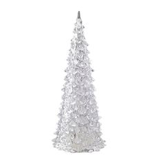 a small white christmas tree on a white background