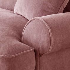 a close up view of the back end of a couch with two pillows on it