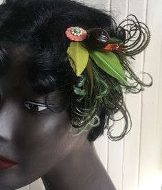 This elegant yet whimsical feathery hair clip features a charming snail perched amidst an array of green ostrich, peacock, rooster and goose feathers, some I've trimmed to resemble leaves.  All feathers used in my pieces are either naturally molted and cruelty free, vintage or repurposed.   This piece is made to order. Please allow 1-2 weeks for me to make this for you before I send it off, but if you need it faster please inquire- it may be possible. This piece is mounted on an alligator clip t Feather In Hair, Feathery Hair, Halloween Headpiece, Feather Hair Clips, Feather Hair, Feathered Hairstyles, Barrettes, Fine Hair, Fascinator