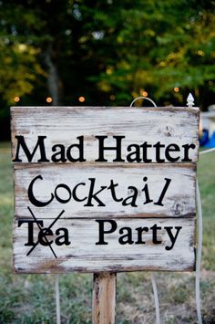 a sign that says mad hatter cocktail tea party