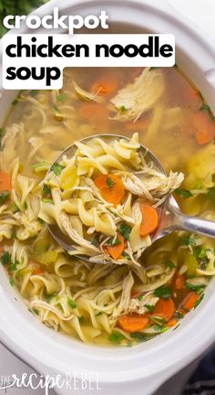 the crockpot chicken noodle soup is ready to be eaten with a spoon