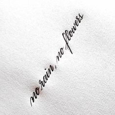 the word mama written in cursive writing on a white paper with black ink