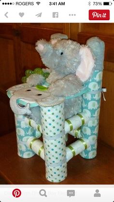 a stuffed elephant sitting on top of a chair