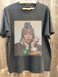 Retro Erykah Badu Country Music Shirt, Erykah Badu Albums Graphic shirt,Erykah Badu Tour 2023 Shirt, Gift for Men Women Unisex T-Shirt : 100% Cotton (fiber content may vary for different colors) .: Medium fabric (5.3 oz/yd² (180 g/m .: Classic fit .: Runs true to size HOW TO ORDER Pick you favorite design. Review the size & color charts above FIRST and then select shirt size and color from the dropdown menu. Indicate the birthday year in the personalization box. Please note size measurements for Fleetwood Mac Shirt, Country Music Shirt, Country Music Shirts, Erykah Badu, 90s Shirts, Concert Shirts, Retro 90s, Color Charts, Graphic Shirt