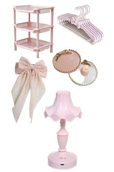 dollhouse furniture and accessories are arranged on a white background, including a pink lamp