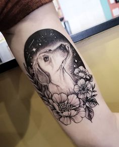 a woman's arm with a deer and flowers on it