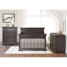 a baby crib and dresser in a room