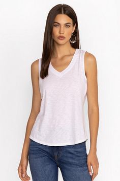 Crafted from a luxuriously soft cotton blend, the Slub Jersey Hi Low Tank is a warm weather wardrobe staple. Featuring a V-neckline and sleeveless cut, this top is finished with a step hem for a relaxed fit. Pair with linen shorts and strappy sandals for a casual weekend pairing. Johnny Was Women's Slub Jersey Hi Low Tank Top in Bright White, Size XL, Linen/Cotton Spring Cotton Heather Tops, Spring Heather Cotton Tops, Embroidered Jeans, Boho Chic Outfits, Johnny Was, Linen Shorts, Strappy Sandals, Bright White, Warm Weather