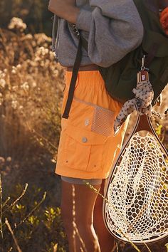 Tackle any trail with these essential shorts featured in a slouchy, relaxed fit with utility-inspired pockets, in a durable, water-resistant fabric. * Mid rise silhouette * Mesh lining * Button closure and zip fly | Morning Meadow Shorts by FP Movement at Free People, Electric Orange Combo, M Essential Shorts, Electric Orange, Free People Activewear, Life Well Lived, Free People Movement, Fp Movement, Water Resistant Fabric, New Tops, Boho Outfits