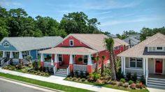 several red and blue houses with palm trees