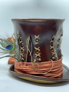 Handmade leather mad hatter tophat. Personalization available. Steampunk Leather Top Hat With Flat Crown, Fitted Leather Top Hat With High Crown, Adjustable Leather Steampunk Top Hat, Leather High Crown Top Hat For Festival, Western Brown Top Hat With High Crown, Vintage Leather Top Hat With Flat Crown, Steampunk Fitted Brown Top Hat, Vintage Brown Top Hat With Flat Crown, Brown Fitted Steampunk Top Hat