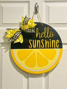 a yellow and black sign that says hello sunshine on the side of a white door